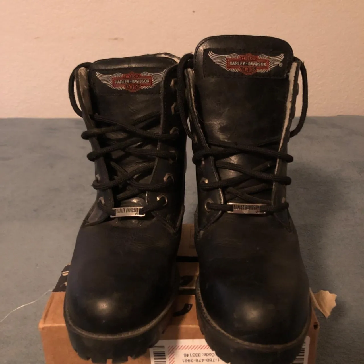 Harley Davidson women's black and orange boots photographed on a box